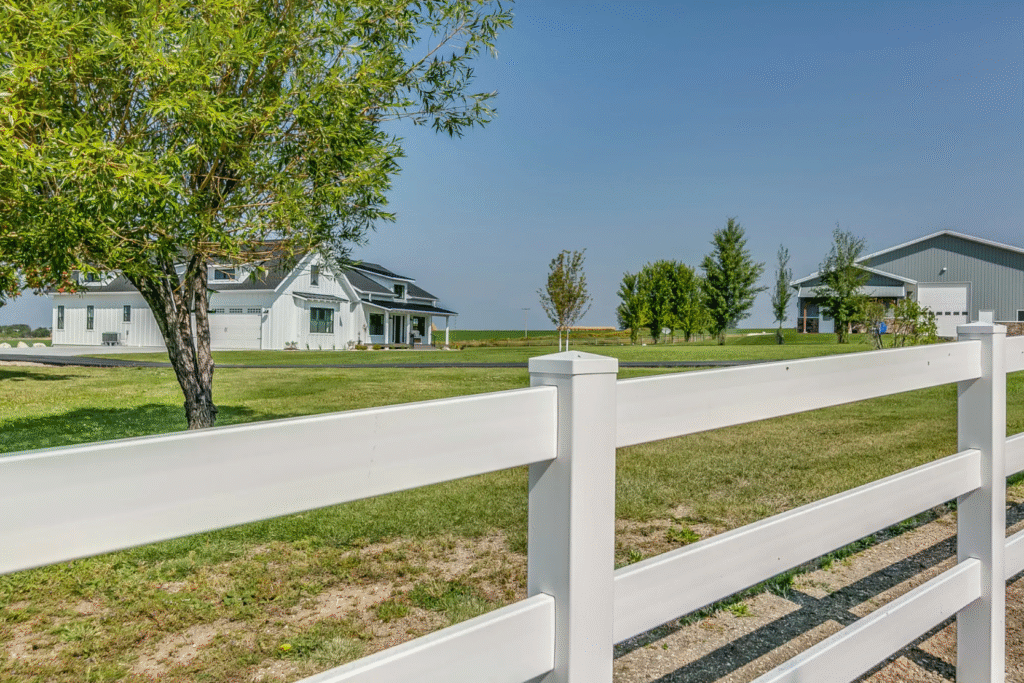 white vinyl fence in Concord in a standard 3 rail farm fence style